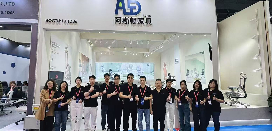 Aston team at furniture exhibition booth
